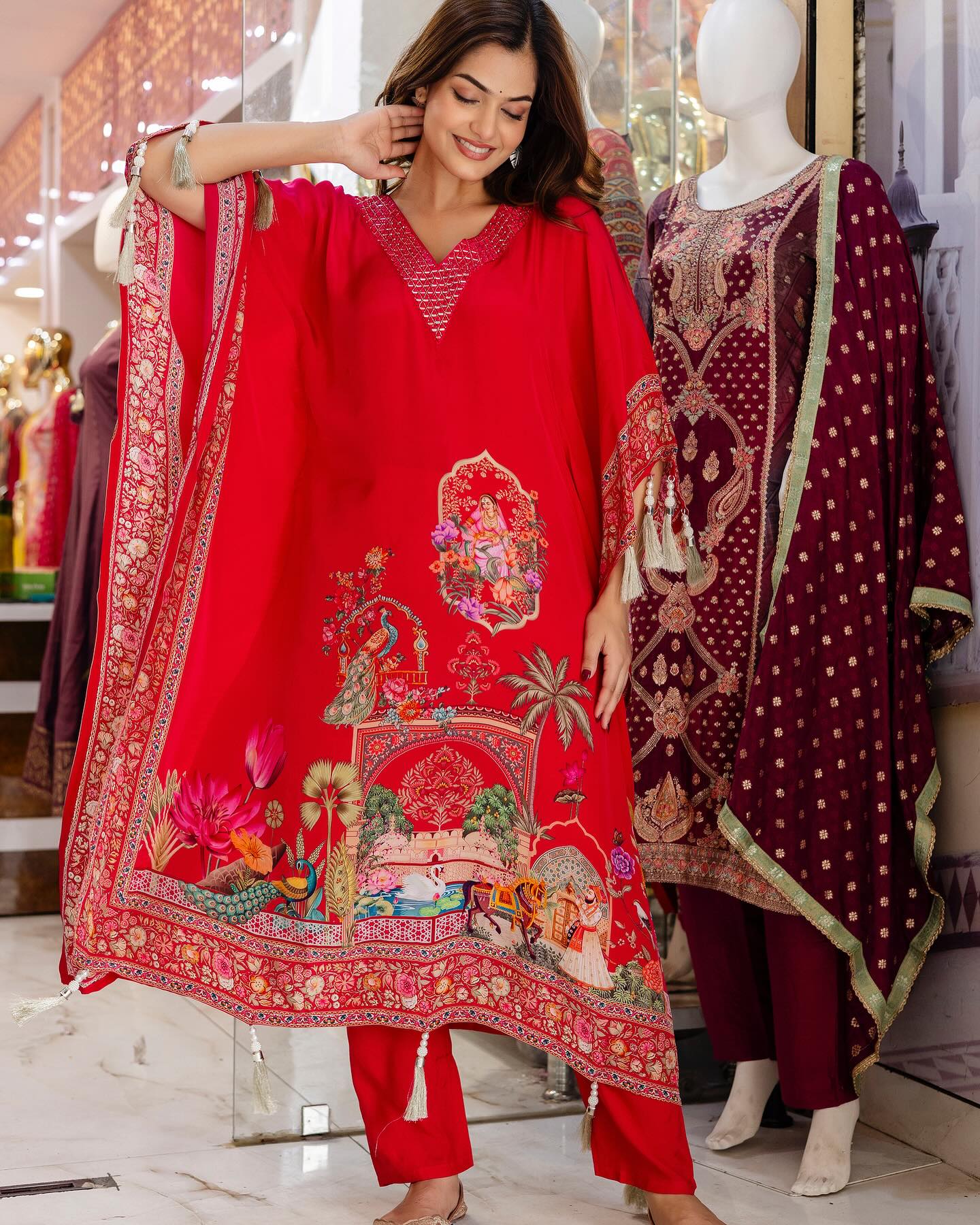 Woman wearing a red embroidered outfit with a mannequin in the background